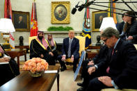 FILE PHOTO: U.S. President Donald Trump, flanked by Energy Secretary Rick Perry, delivers remarks as he welcomes Saudi Arabia's Crown Prince Mohammed bin Salman in the Oval Office at the White House in Washington, U.S. March 20, 2018. REUTERS/Jonathan Ernst/File Photo