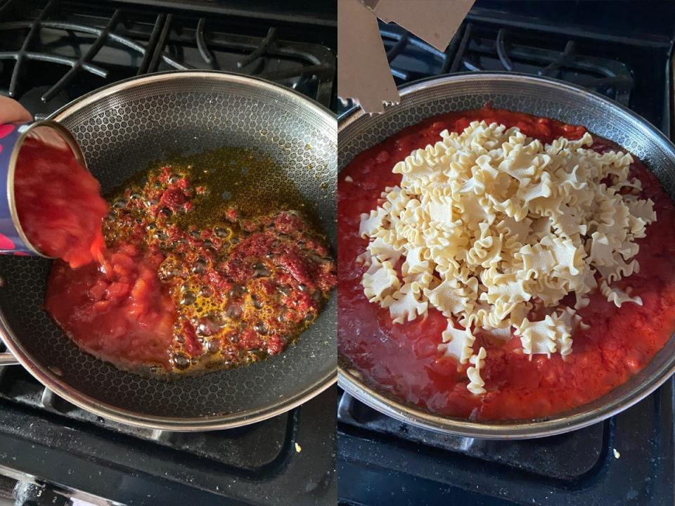 Pasta sauce and noodles simmering inside a pan.