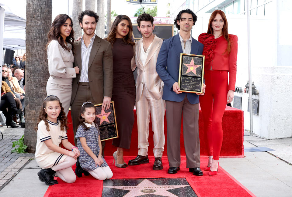 HOLLYWOOD, CALIFORNIA - JANUARY 30: (L-R) Danielle Jonas, Kevin Jonas, Priyanka Chopra, Nick Jonas, Joe Jonas, Sophie Turner, and (front) Alena Rose Jonas and Valentina Angelina Jonas attend The Hollywood Walk of Fame star ceremony honoring The Jonas Brothers on January 30, 2023 in Hollywood, California. (Photo by Amy Sussman/Getty Images)