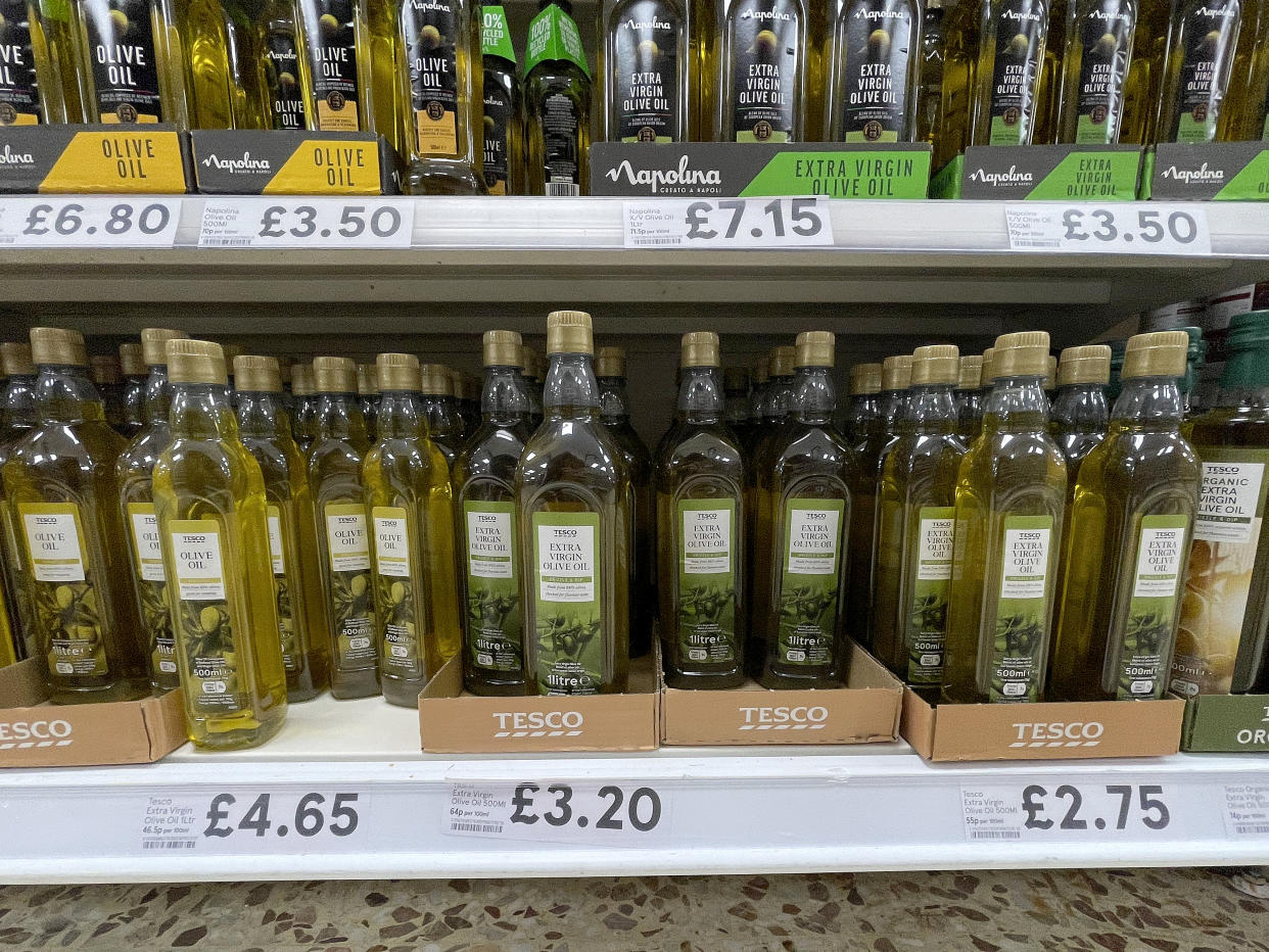 NORTHWICH, ENGLAND - JULY 06: Olive oil sits on display in a Tesco supermarket on July 06, 2022 in Northwich, England. The British Retail Consortium recently said food manufacturers and supermarkets are having to pass on some of the cost of soaring raw materials to consumers, leading to the price of basic goods throughout the UK rising at the fastest pace since September 2008. Fresh food prices increased by 6% in the year to June 2022 coupled with an increase in inflation, and fuel and energy prices to create a cost of living crisis.  This is leading to millions of low-income households going without essentials items, falling behind on bills and taking on debt. (Photo by Christopher Furlong/Getty Images)