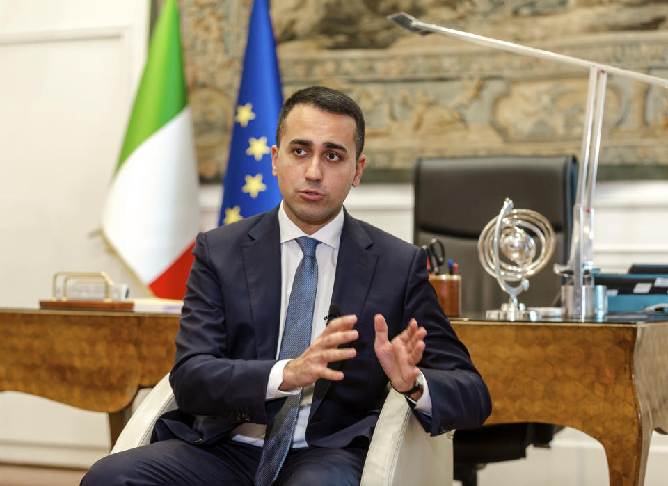 Italian Foreign Minister Luigi Di Maio speaks during an interview with The Associated Press in his studio in Rome, Tuesday, Feb. 4, 2019. Di Maio says there is no risk his country will leave the European Union but is calling for reforms to give more weight to European lawmakers since they are directly elected by citizens. (AP Photo/Domenico Stinellis)