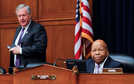 Ranking Republican member Rep Mark Meadows (R-NC) looks over at House Oversight and Reform Committee chairman Elijah Cummings (D-MD) as Cummings chairs a debate on the possibility of issuing a subpoena to a former White House security clearance chief on whistleblower allegations that career officials' decisions to deny security clearances to Donald Trump advisors were inappropriately reversed by Trump administration supervisors, as the committee meets on Capitol Hill in Washington, U.S., April 2, 2019. REUTERS/Carlos Barria