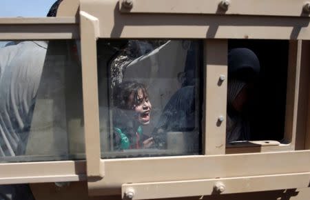 A girl cries after she was rescued by Iraqi security forces at Old City in western Mosul, Iraq June 23, 2017. REUTERS/Erik De Castro