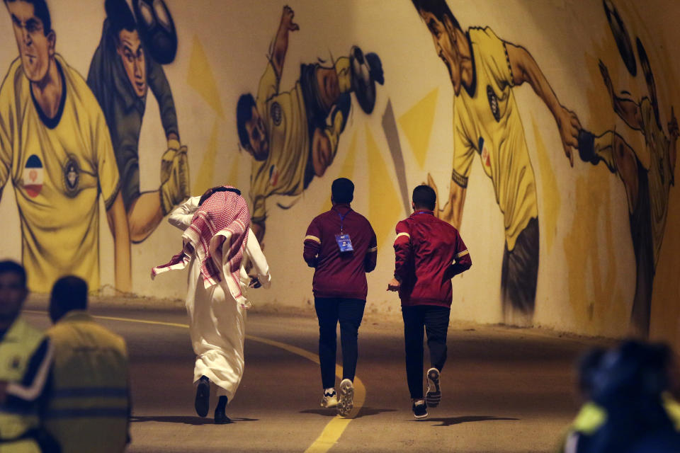 In this photo provided by Iranian Students' News Agency, ISNA, members of Saudi Arabia's Al Ittihad soccer team leave Naghsh-e-Jahan stadium in the central city of Isfahan, Iran, Monday, Oct. 2, 2023. Al Ittihad refused to play a match in Iran on Monday because of the presence of a statue of a slain Iranian general Qassem Soleimani placed on the sideline, Saudi state media reported. (Behrouz Naderi, ISNA via AP)