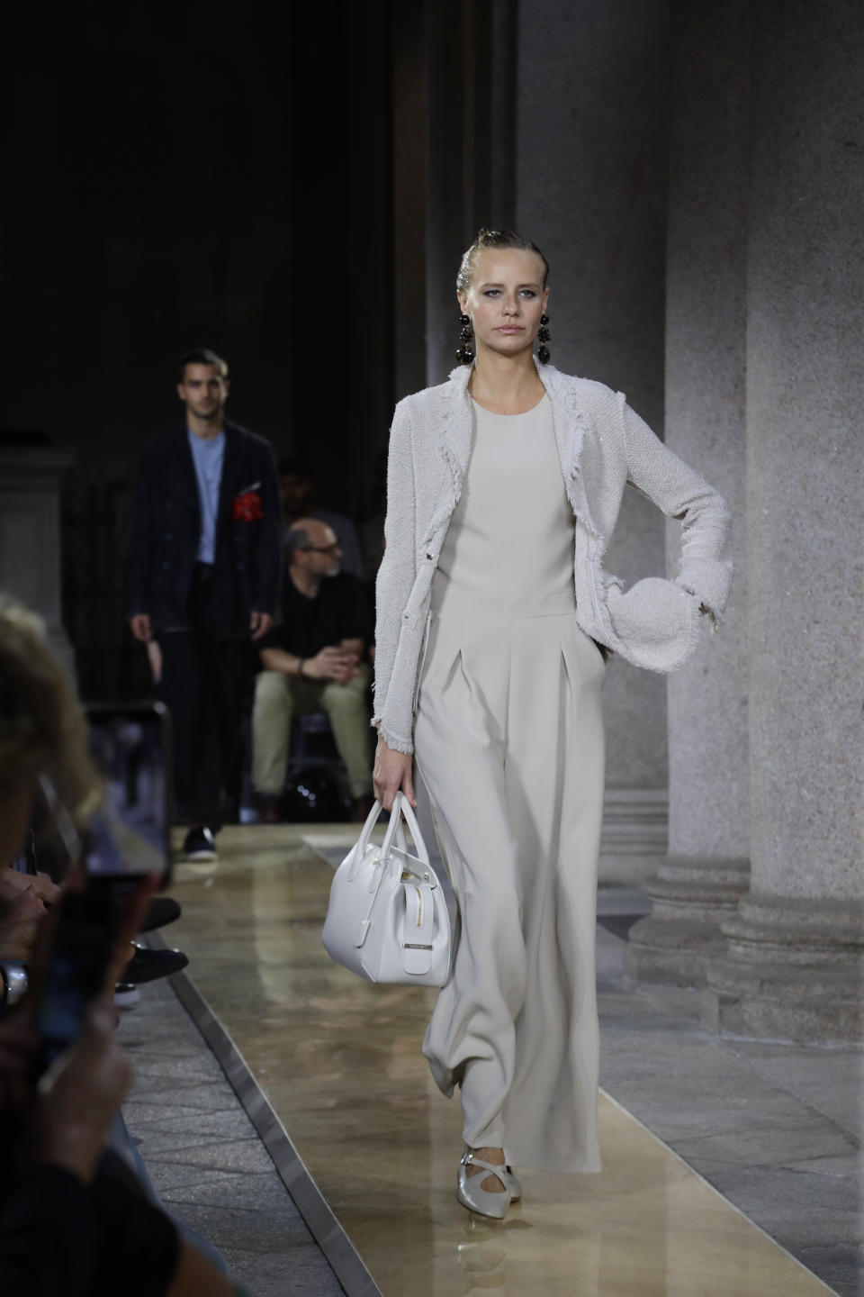 A model wears a creation as part of the Armani men's Spring-Summer 2020 collection, unveiled during the fashion week, in Milan, Italy, Monday, June 17, 2019. (AP Photo/Luca Bruno)