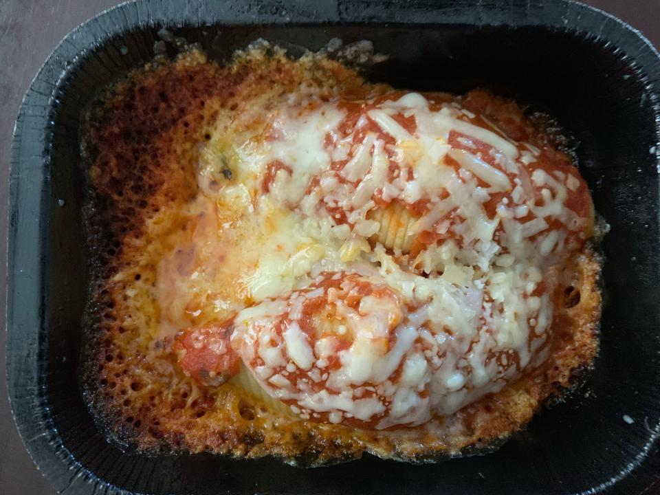 Cooked Trader Joe's stuffed shells in black microwaveable container
