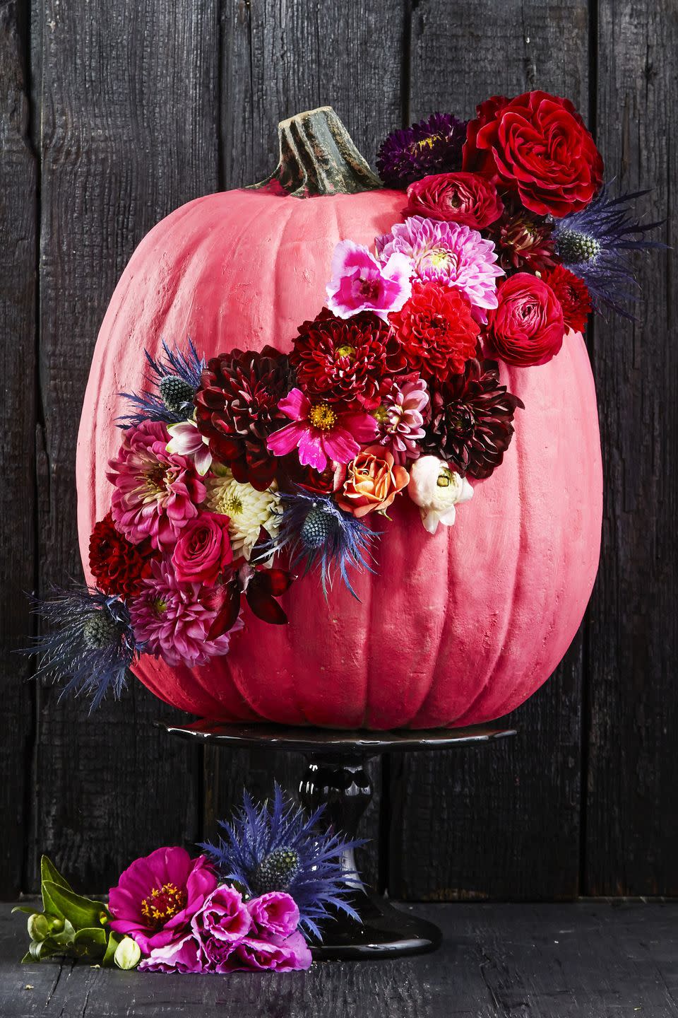 <p>After coating your gourd in a new bright hue, add some texture with fresh seasonal blooms. Autumn favorites such as chrysanthemums, dahlias, and ranunculus make it particularly stunning. </p><p>Get the tutorial at <em><a href="https://www.goodhousekeeping.com/holidays/halloween-ideas/g1714/no-carve-pumpkin-decorating/?slide=36" rel="nofollow noopener" target="_blank" data-ylk="slk:Good Housekeeping;elm:context_link;itc:0;sec:content-canvas" class="link ">Good Housekeeping</a></em>.</p>