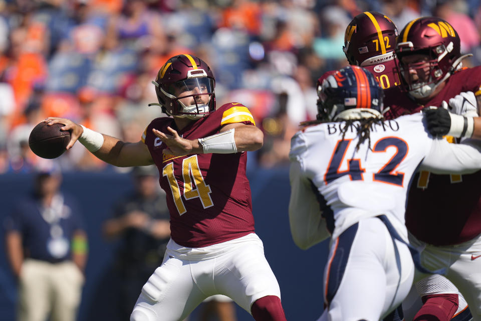 Washington Commanders quarterback Sam Howell looks to pass against the Denver Broncos in the first half of an NFL football game Sunday, Sept. 17, 2023, in Denver. (AP Photo/Jack Dempsey)