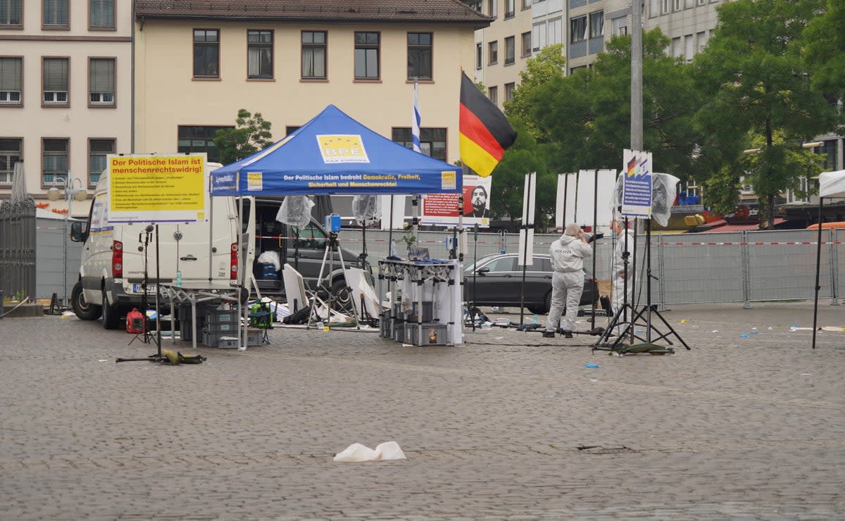 Police at the scene in Mannheim’s central square (REUTERS)