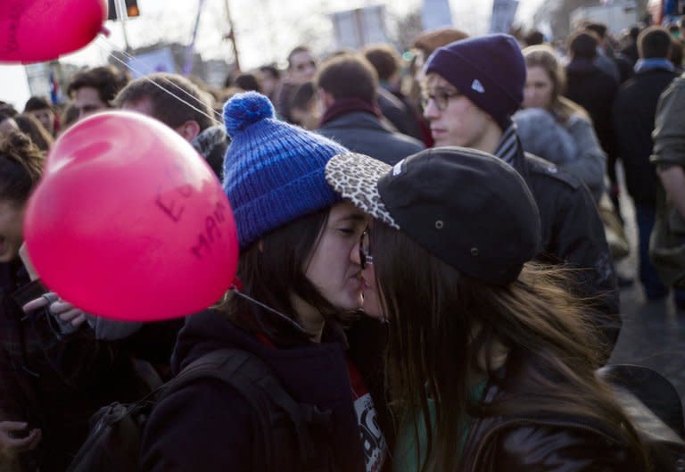 A lesbian couple kiss on Bastille square, in Paris on December 16, 2012 during a demonstration for the legalisation of gay marriage and LGBT (lesbian, gay, bisexual, and transgender) parenting. Pope Benedict XVI on Friday weighed in on a heated debate over gay marriage, saying same-sex unions called into question what it means to be "true men"