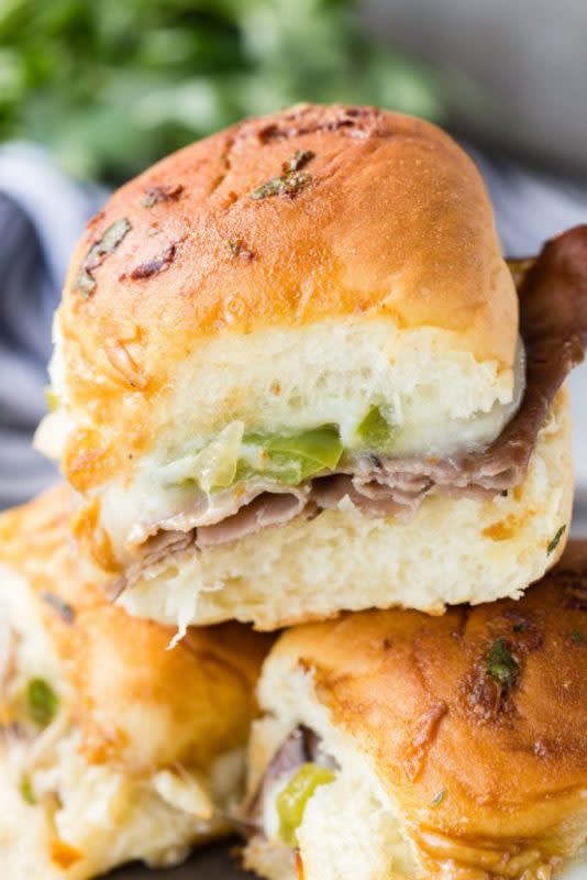 <p>Eazy Peazy Mealz</p><p>Slow-roasted, artisan-quality roast beef, creamy provolone cheese, delicious onions and peppers, all inside a roll topped with a delicious buttery sauce that takes these over the top and makes them the perfect picnic lunch option!</p><p><strong>Get the recipe: <a href="https://www.eazypeazymealz.com/philly-cheesesteak-sliders/" rel="nofollow noopener" target="_blank" data-ylk="slk:Philly Cheesesteak Sliders;elm:context_link;itc:0;sec:content-canvas" class="link ">Philly Cheesesteak Sliders</a></strong></p>