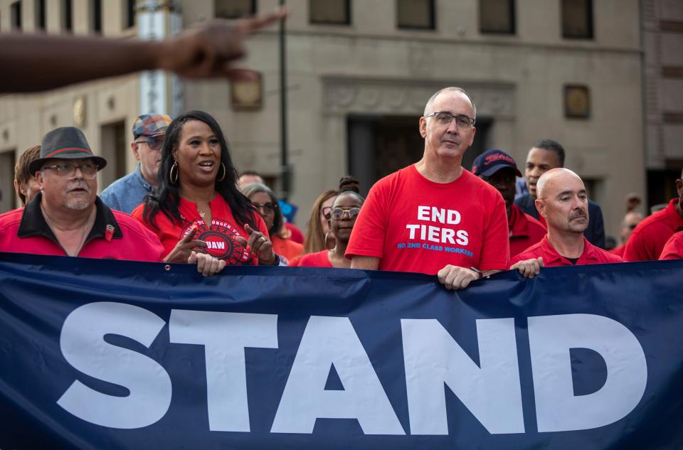 UAW President Shawn Fain walks with dozens of UAW members during a rally outside the UAW-Ford Joint Trusts Center in Detroit on Friday, Sept. 15, 2023.