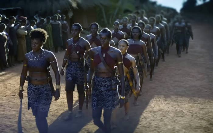 Viola Davis, Lashana Lynch, and Sheila Atim marching in The Woman King