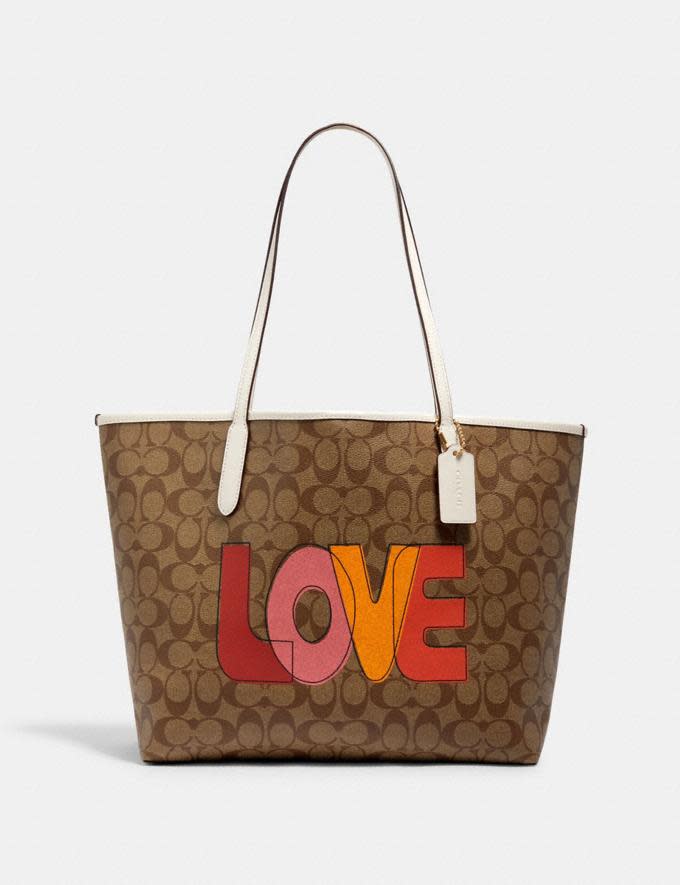 City Tote In Signature Canvas With Love Print. Image via Coach Outlet.