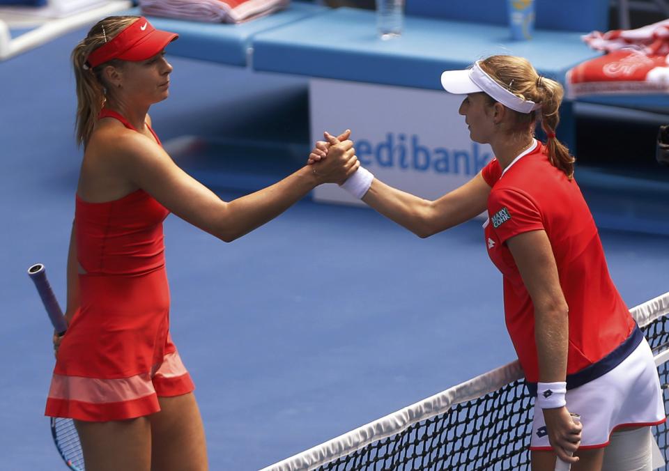 Maria Sharapova (L) of Russia shakes hands with compatriot Ekaterina Makarova of Russia after winning their women's singles semi-final match at the Australian Open 2015 tennis tournament in Melbourne January 29, 2015. REUTERS/Brandon Malone (AUSTRALIA - Tags: SPORT TENNIS)