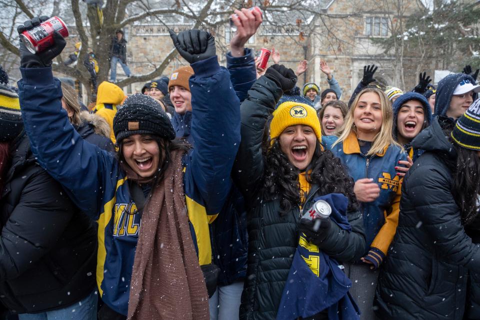 Fans celebrate the University of Michigan football team in Ann Arbor on Saturday, Jan. 13, 2024. The Wolverines were crowned 2023 National Champions.