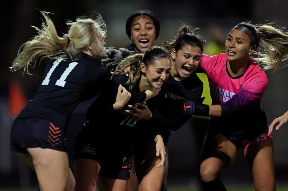 Atlantic Coast's Evangelina Arocho (10) is mobbed by teammates after scoring a goal against Stanton.