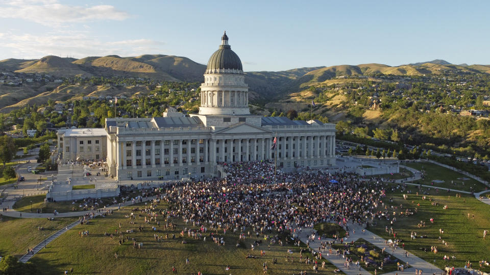 People attend an abortion-rights protest at the Utah State Capitol, Friday, June 24, 2022, in Salt Lake City. The U.S. Supreme Court's decision to end constitutional protections for abortion has cleared the way for states to impose bans and restrictions on abortion — and will set off a series of legal battles.(AP Photo/Rick Bowmer)