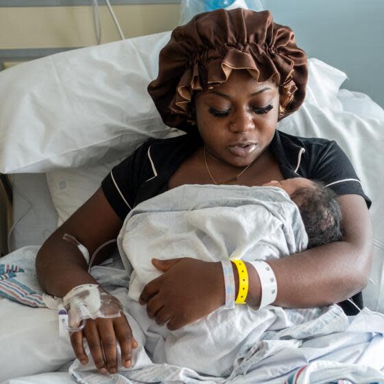Brianna McKenzie, 23, holds her newborn baby boy in the Labor & Delivery Unit at MLK Community Hospital