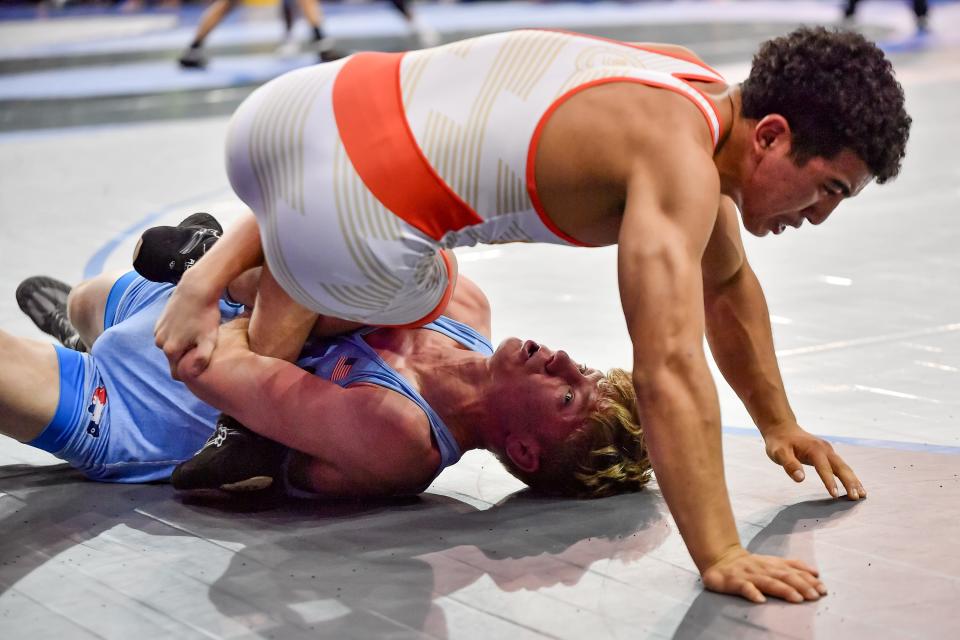 The leg lace of Wadsworth's Jaxon Joy, bottom, is a thing of beauty and has the senior looking for his second All-America honor at the Junior Freestyle National Championships in Fargo, N.D.