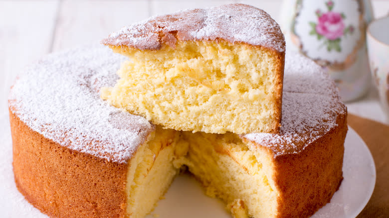 Slice of pound cake on top of cake 