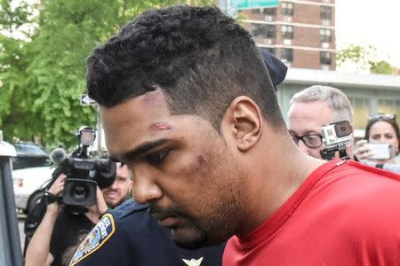 Richard Rojas is escorted from the 7th precinct by New York City Police officers after being processed in connection with the speeding vehicle that struck pedestrians on a sidewalk in Times Square in New York City, U.S., May 18, 2017. REUTERS/Stephanie Keith