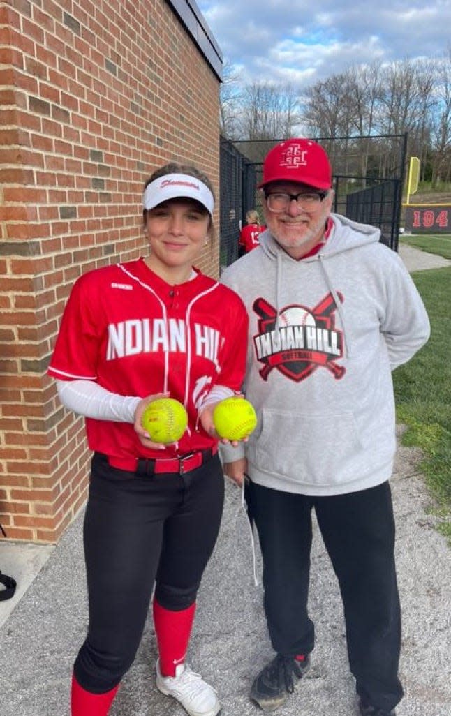 Indian Hill’s Zoey Glenn and head coach Phil Said celebrate Glenn’s two home runs against Mariemont on April 5, 2024.