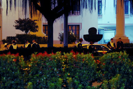 Policemen are stationed at a road near Ocean Garden at Taipa in Macau, China February 15, 2017. REUTERS/Bobby Yip