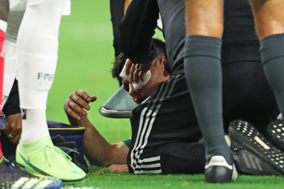 ARLINGTON, TX - JULY 10: Hirving Lozano #22 of Mexico is injured during the match of CONCACAF Gold Cup Group A between Mexico and Trinidad & Tobago at AT&T Stadium on July 10, 2021 in Arlington, Texas. (Photo by Omar Vega/Getty Images)