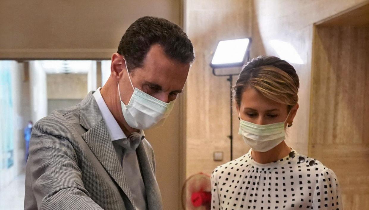 <p>Bashar al-Assad and his wife Asma</p> (AFP)