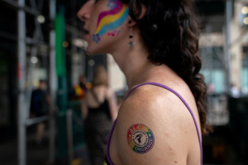 Starbucks workers attend a protest as part of a collective action over a Pride decor dispute, outside a Starbucks shop