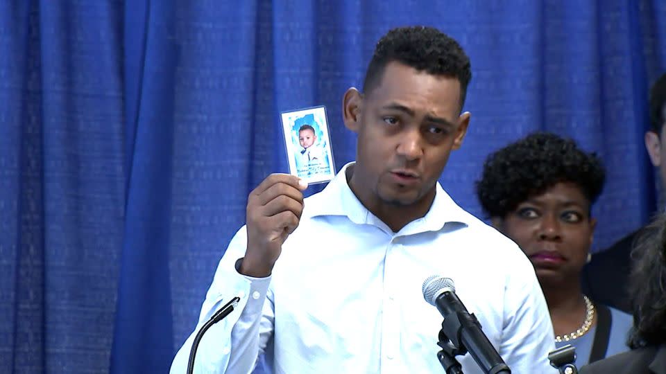 Otoniel Feliz holds a memorial photo of his 1-year-old son  Nicholas Dominici. He spoke alongside Bronx District Attorney Darcel Clark, who announced indictments in connection with the boy's death. - WABC