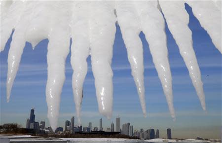 The Chicago skyline is framed by icicles in Chicago, Illinois, January 8, 2014. REUTERS/Jim Young