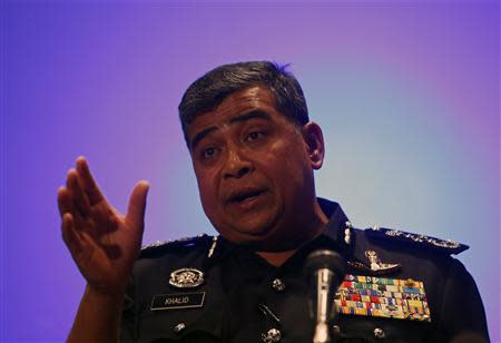 Malaysia's police chief, Inspector General Khalid Abu Bakar, addresses a news conference on the two passengers who had travelled onboard the missing Malaysia Airlines MH370 plane on stolen passports in Kuala Lumpur International Airport March 11, 2014. REUTERS/Edgar Su