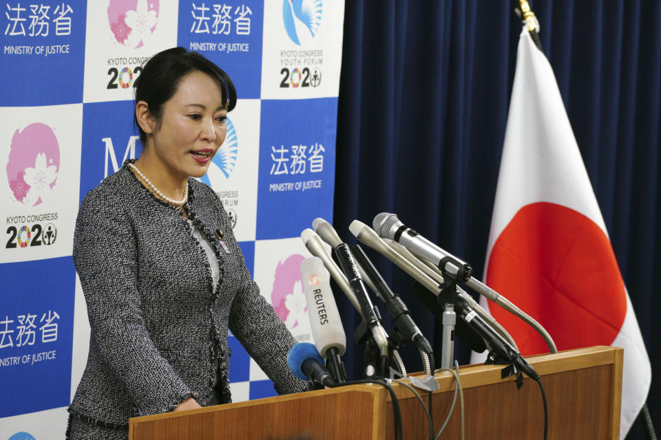 Japanese Justice Minister Masako Mori speaks about Nissan's former chairman Carlos Ghosn during a press conference at her ministry in Tokyo Thursday, Jan. 9, 2020. Mori is denouncing Ghosn's criticism of the nation's criminal justice system. Mori said she wanted to prevent his spreading an "erroneous" understanding abroad about Japan's system. Ghosn, who skipped bail while awaiting trial here, said in Beirut that Japan's system was unfair and rigged. (AP Photo/Eugene Hoshiko)
