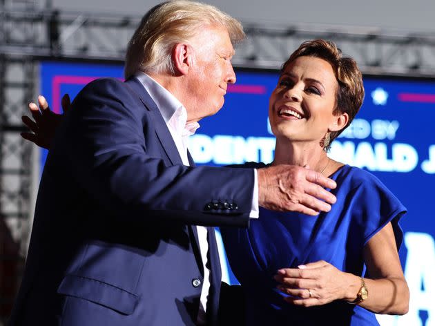 Former President Donald Trump embraces Arizona Republican Kari Lake at a campaign rally on Oct. 9 in Mesa, Arizona. Trump was stumping for Arizona GOP candidates ahead of the midterm election on Nov. 8.