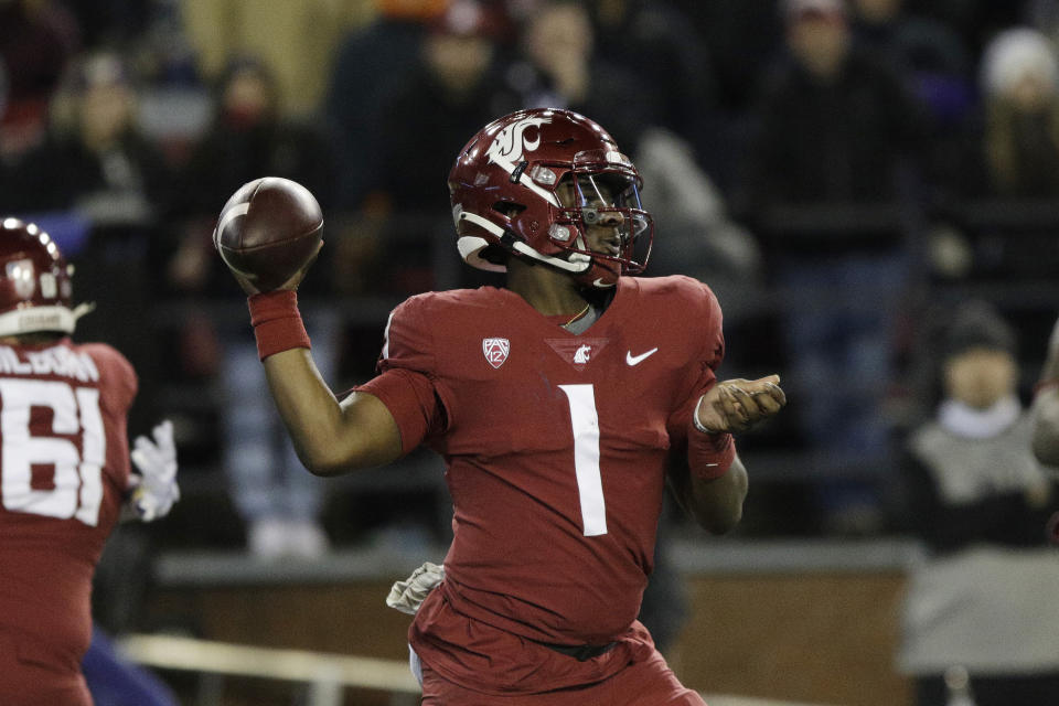 Washington State quarterback Cameron Ward throws a pass during the first half against Washington on Nov. 26, 2022, in Pullman, Washington. (AP Photo/Young Kwak)