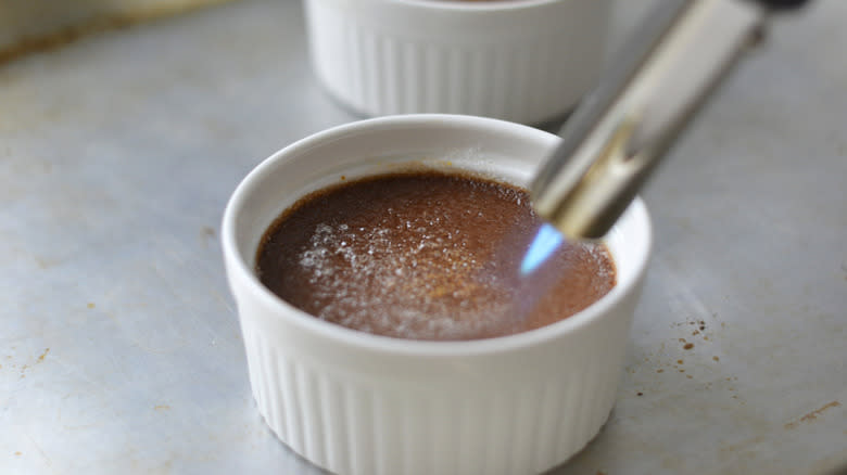 kitchen blow torch on sugar for chocolate creme brulee