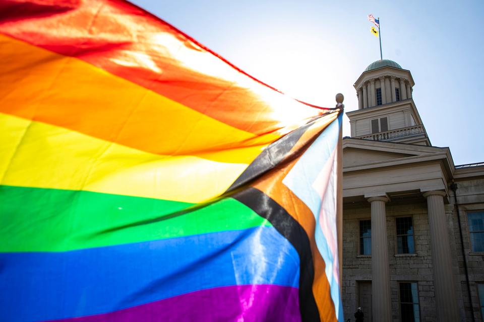 A Progress Pride LGBTQ flag waves in the wind during a Trans Day of Visibility event, Saturday, April 1, 2023, at the Old Capitol in Iowa City, Iowa.