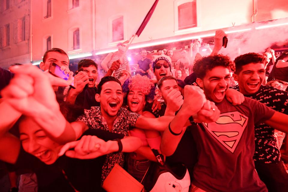 <p>People celebrate France’s victory in Marseille on July 10, 2018 after the final whistle of the Russia 2018 World Cup semi-final football match between France and Belgium. (Photo by Boris HORVAT / AFP) </p>