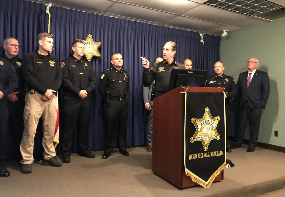 Oakland County Sheriff Michael Bouchard pointed to a list of 3 dozen law enforcement agencies that have signed on to a task force opposing 'transnational gangs,' which Bouchard said have targeted high-end houses in metro Detroit for property thefts at a news conference on Dec. 6, 2023.