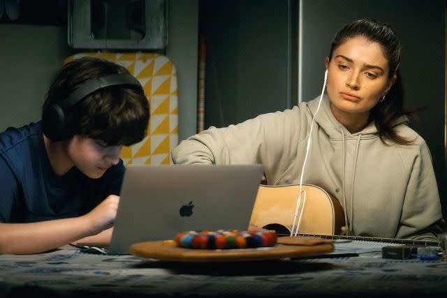 <p>Apple TV+</p> Orén Kinlan and Eve Hewson in "Flora and Son"