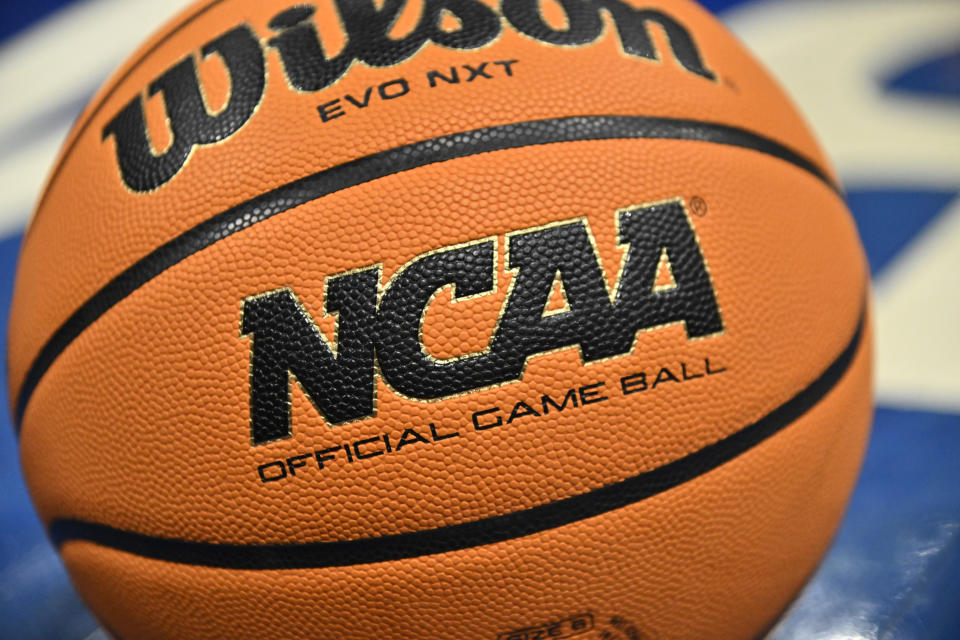 FILE - An official game ball sits on the court during the second half of an NCAA college basketball game between Southern California and UCLA in the semifinals of the Pac-12 tournament Friday, March 8, 2024, in Las Vegas. NCAA President Charlie Baker on Wednesday, March 26, urged lawmakers in states with legal wagering on sporting events to ban betting on individual player performances.(AP Photo/David Becker, File)