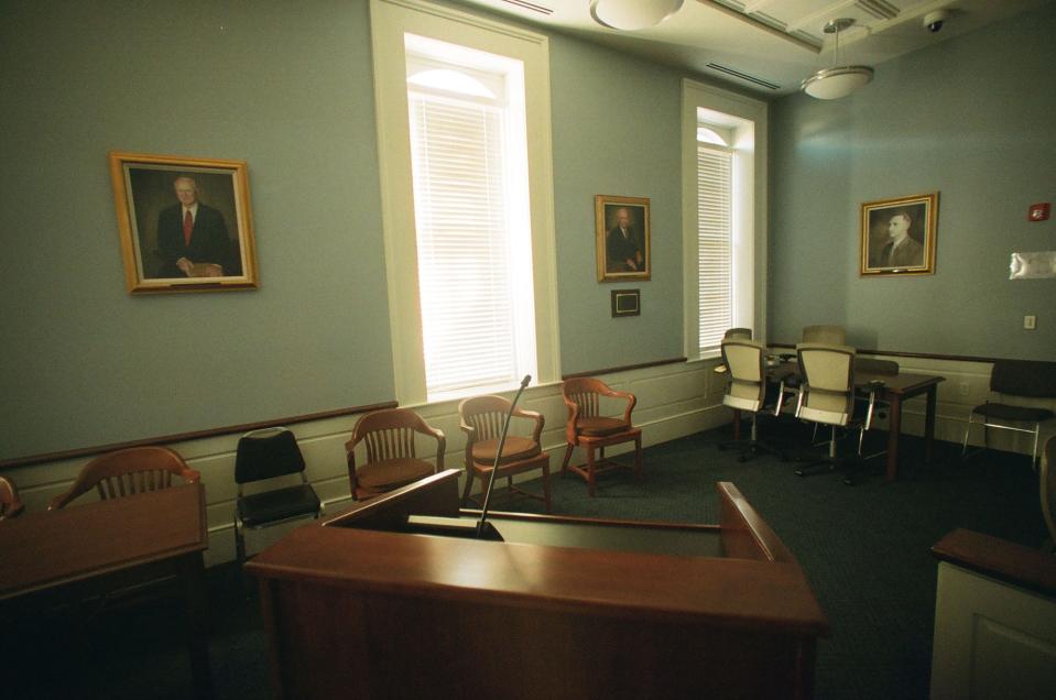 Portraits of former solicitors Randolph Murdaugh, Sr., Randolph “Buster” Murdaugh, and Randolph Murdaugh III hang on the wall inside the courtroom at the Hampton County courthouse in Hampton, South Carolina.