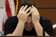 Former Marjory Stoneman Douglas High School student Kyle Laman, who was injured in the 2018 shootings, reacts as surveillance video of the massacre is played in court on the second day of testimony in the case of former MSD High School School Resource Officer Scot Peterson at the Broward County Courthouse in Fort Lauderdale on Thursday, June 8, 2023. Broward County prosecutors charged Peterson, a former Broward Sheriff's Office deputy, with criminal charges for failing to enter the 1200 Building at the school and confront the shooter as he perpetuated the Valentine's Day 2018 Massacre. (Amy Beth Bennett/South Florida Sun-Sentinel via AP, Pool)