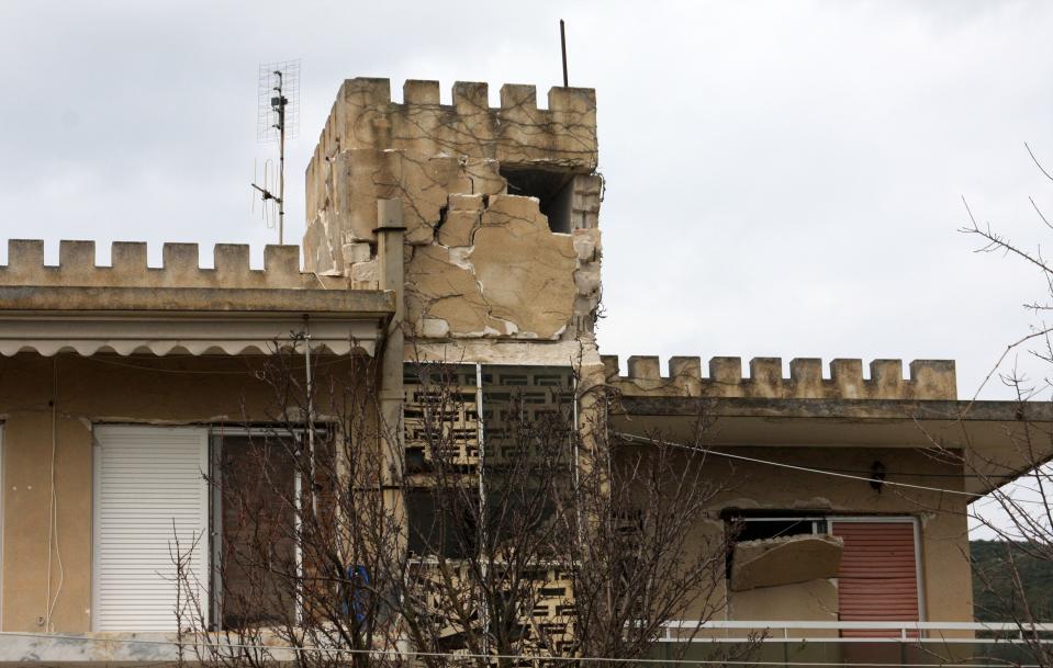 The collapsed wall of a house after an earthquake in Lixouri town on the island of Kefalonia, western Greece, Monday, Jan. 27, 2014. Greece’s government announced emergency relief for the residents of the Ionian islands of Kefalonia and Ithaki Monday, a day after they were hit by a strong quake which caused damage and slightly injured seven people. Sunday’s quake, whose magnitude the Athens Geodynamic Institute revised to 5.9 from the preliminary 5.8, has been followed by dozens of aftershocks that continued throughout the night and through Monday. (AP Photo/Giannis Soulis)