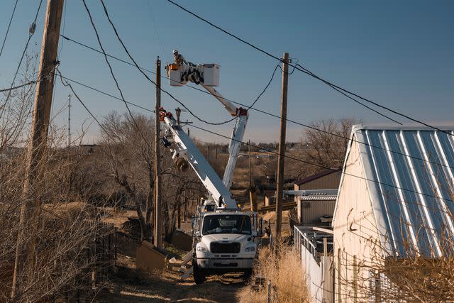 <p>Jordan Vonderhaar/Bloomberg via Getty</p> A utility crew repairs damaged power lines following the Smokehouse Creek Fire in Fritch, Texas, US, on Saturday, March 2, 2024. Texas emergency crews are battling the worst wildfire in state history amid forecasts for several more days of dry, windy weather that will make their task more difficult.