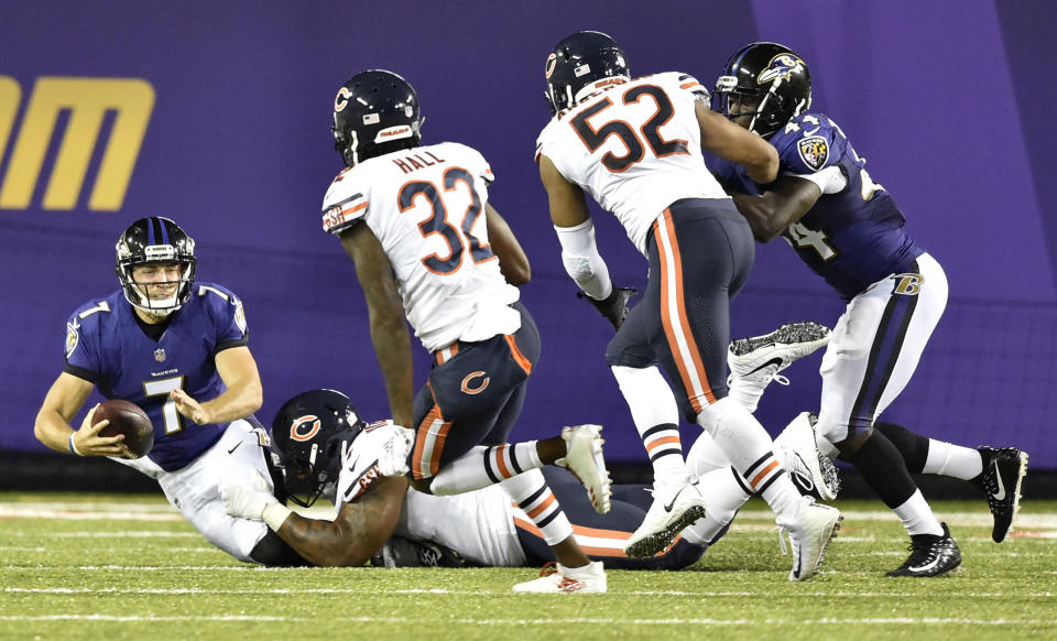 Baltimore Ravens quarterback Josh Woodrum (7) is sacked in the first half against the Chicago Bears at the Pro Football Hall of Fame NFL preseason game, Thursday, Aug. 2, 2018, in Canton, Ohio. (AP Photo/David Richard)