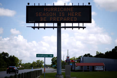 A traffic sign warns of hurricane season in Stowell, Texas, U.S., June 12, 2018. Picture taken June 12, 2018. REUTERS/Jonathan Bachman