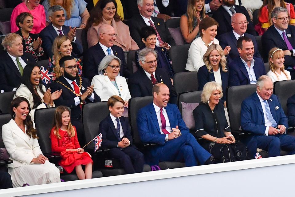 (From L) Britain's Catherine, Duchess of Cambridge, Britain's Princess Charlotte of Cambridge, Britain's Prince George of Cambridge, Britain's Prince William, Duke of Cambridge, Britain's Camilla, Duchess of Cornwall and Britain's Prince Charles, Prince of Wales attend the Platinum Party at Buckingham Palace on June 4, 2022 as part of Queen Elizabeth II's platinum jubilee celebrations. - Some 22,000 people and millions more at home are expected at a star-studded musical celebration for Queen Elizabeth II's historic Platinum Jubilee. (Photo by Niklas HALLE'N / POOL / AFP) (Photo by NIKLAS HALLE'N/POOL/AFP via Getty Images)